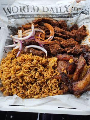 Suya Steak with joll of rice and plantains yummy!!