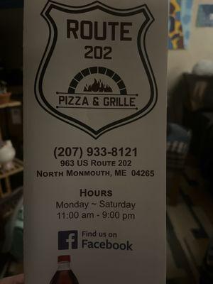 Front of menu with address and phone number