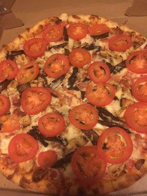 Chicken pizza with bacon, onions, Portabella mushrooms and tomatoes  amazing!!!!