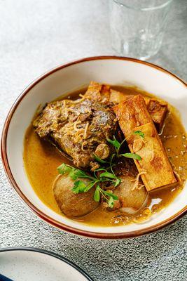 Braised beef cheek mussaman curry with roast shallot and potato pave