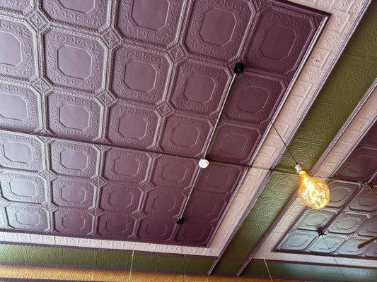 Beautiful purple and green ceilings -- makes for a cozy atmosphere.