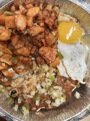 Salmon cake , home fries and a sunny side up egg