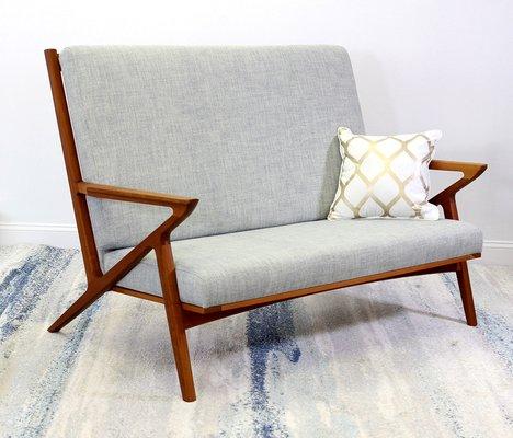 This lovely Holloway Loveseat combines the best in comfort and MCM design!