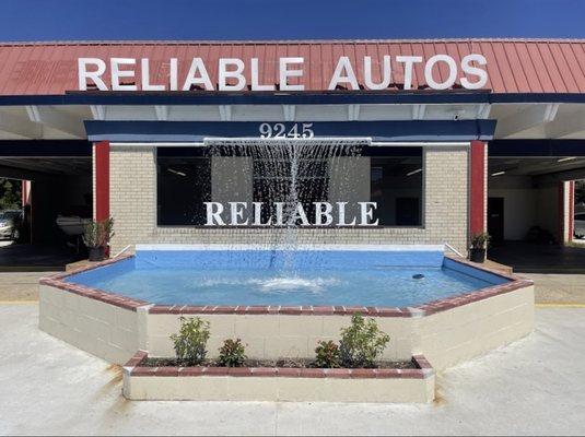 A water fountain at a car lot no one has seen before