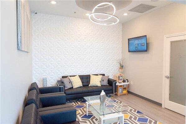 Our waiting room offers a snack and beverage bar, a children's play area, and more!