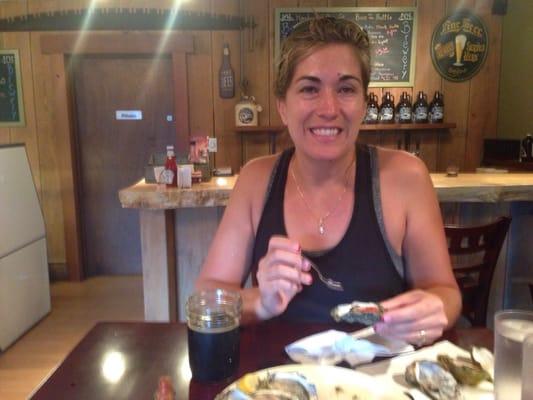 Angela enjoying Oysters and a Look Out Stout