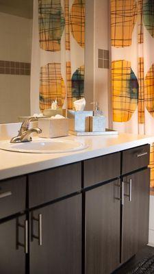 Apartment Bathroom with vanity mirror.