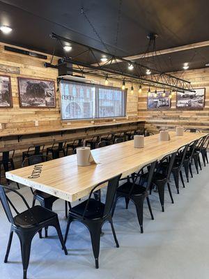 A long family style dining table made from an actual bowling alley