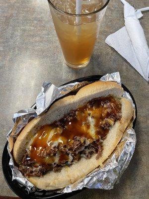 Smoked BBQ Beef Brisket Dog w/ yummy Arnold Palmer in the back