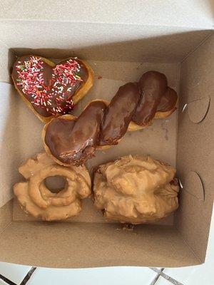 Heart shaped donut for Valentine's Day, chocolate twist, maple old fashioned, and maple buttermilk