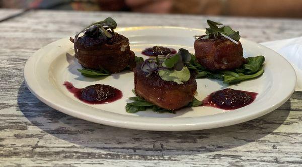 Bacon wrapped scallops with a blueberry reduction for an appetizer. Delicious.