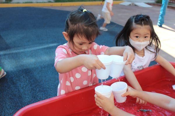 water sensory table during the warm summer months