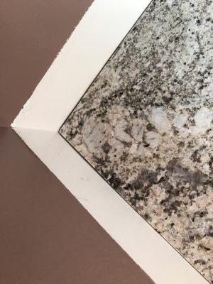 Picture of corner where granite meets wall.