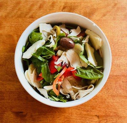 Signature Salad: roast chicken, mixed greens, tomatoes, roasted peppers, artichokes, olives & fresh mozzarella with creamy garlic & herb