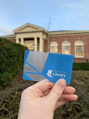 Library Card in front of St Johns Library