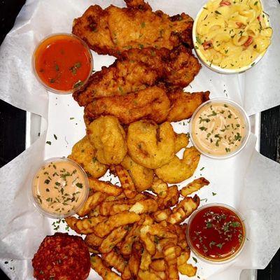 Mini Chick'N Coup platter
3 jumbo tenders, 5 fried shrimp, fries, queso mac n cheese, and 1 flaming hot cheeto boudin ball