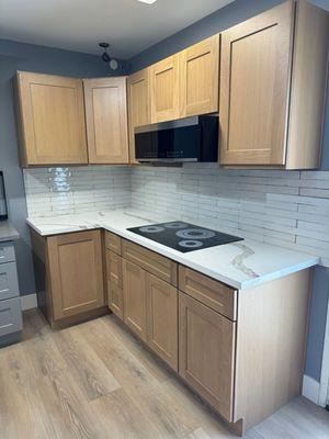 Counter top and cabinets with microwave and electric stove