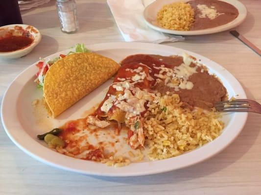 Chicken taco and chicken enchilada. Green chili in each item store bought enchilada sauce and hard shell. Rice and beans were fine.