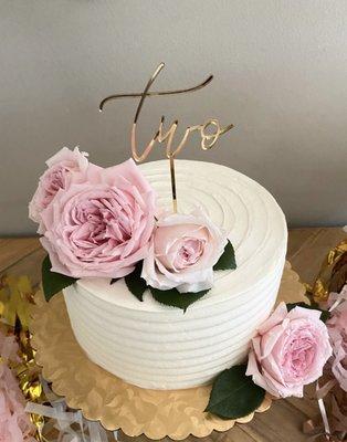 8" cake (came with the gold cake round; flowers and "two" cake topper added by me)