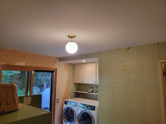 Laundry room after primer and paint.