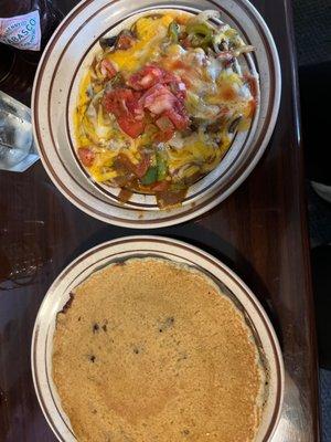 Vegetable Rancheros and single buckwheat blueberry pancake