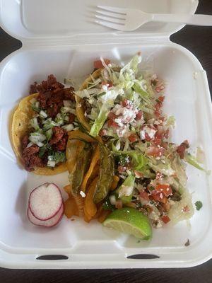 Two sopes de asada and a taco de chorizo.