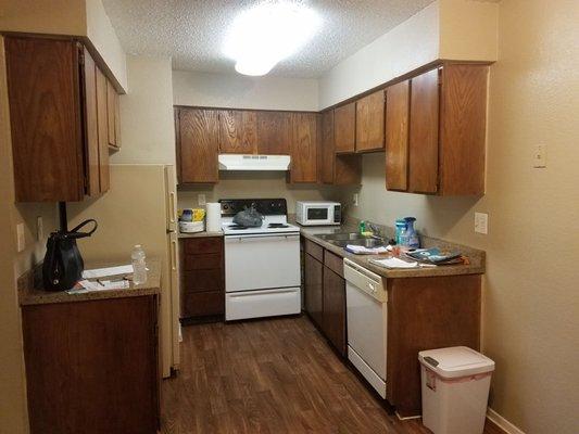 Here is the lovely "updated" kitchen. Warped cabinets that didn't close and old appliances.