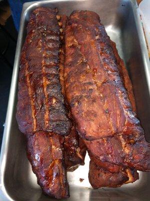 Whole racks of baby back ribs.