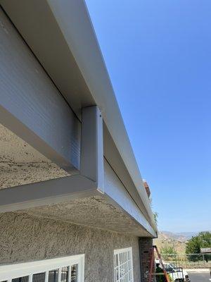 Flat face gutter with smooth downspouts in west hills