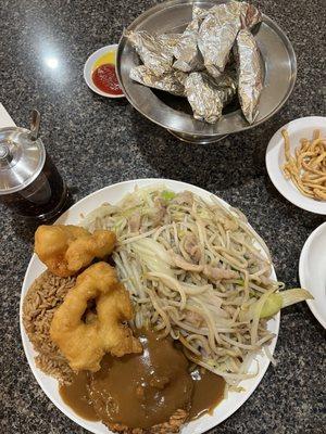 Egg foo young, fried shrimp, fried rice, chow mein, paper wrapped chicken.