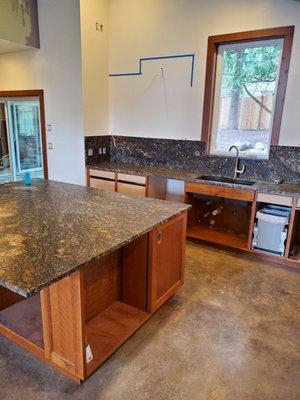 Another view of island and kitchen counters.