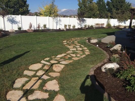 flagstone walkway and backyard landscaping