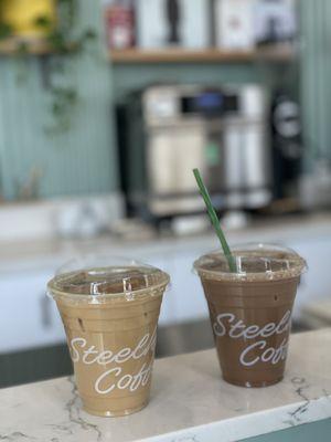 Almond milk latte and soy latte with mocha, both iced