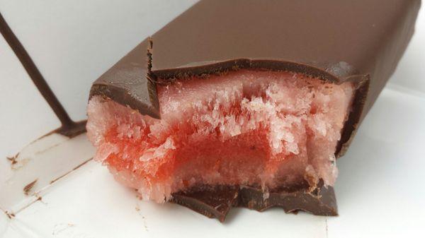 Dark chocolate draping watermelon chili paleta.