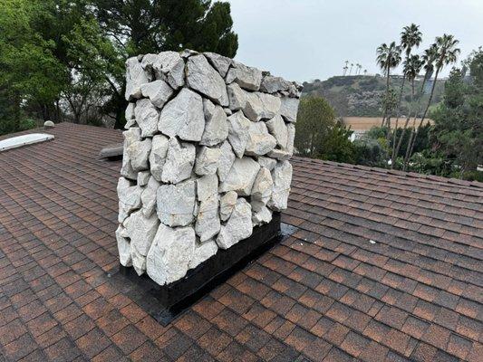 Final product of custom rock chimney. He's the envy of the entire neighborhood.