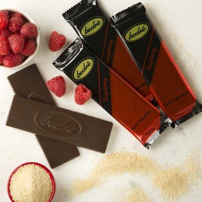 Our dark chocolate raspberry bar is a rich, fruity creation. With sweet raspberry inside a covering of our one-of-a-kind dark chocolate.