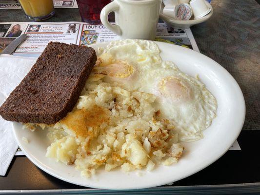 2 eggs over easy with home fries and scrapple