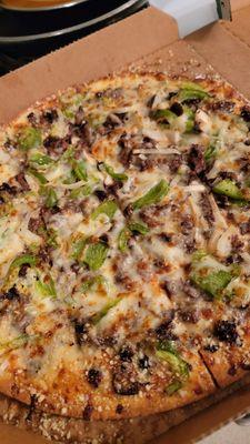 Thin crust philly cheesesteak pizza