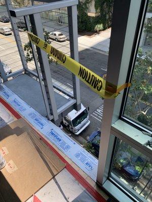 Inside our condo unit...caution tape protection from an open window.