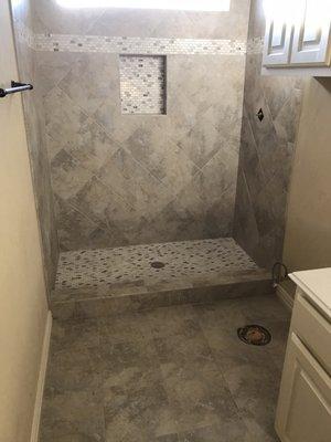 Project in process- looking great! New tile throughout the bathroom and we love the accent tile