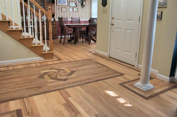 Number one common red oak with walnut border, American cherry inset and a five point medallion.