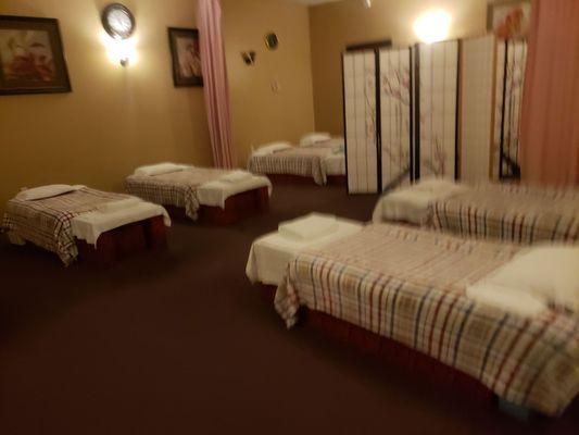 Room for a regular massage. You keep your clothing on. They also have private rooms.