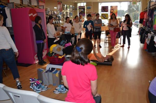 The Wellness Bank giving our ladies' night attendees great foam rolling techniques