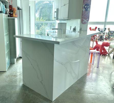 The bottom of our old countertop was just sheet rock. Now it is a single slab that is cut so the veining matches at the corner