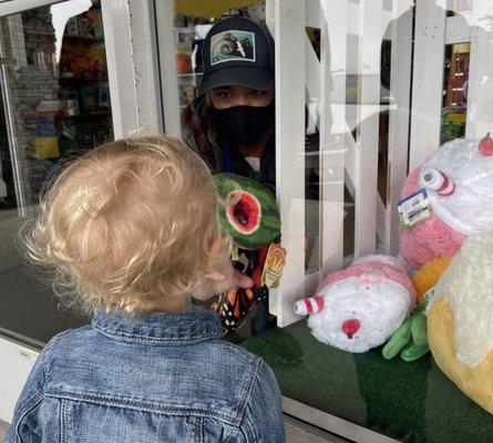 Our daughter checking out the amazing window display of stuffed animals shown off by the staff.