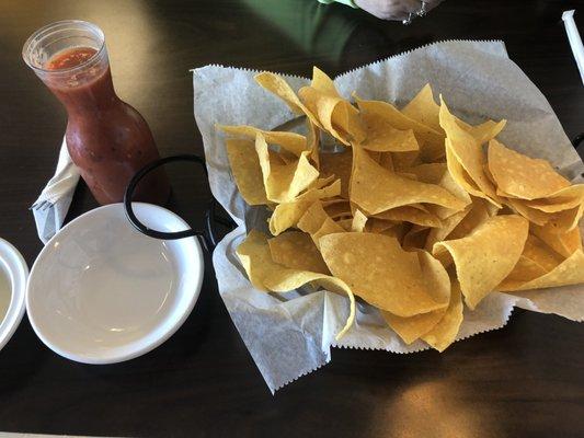 Warm chips and flask of salsa