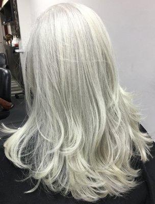 There's no such thing as one size fits all when it comes to coloring your hair. Request a long layer platinum haircut at Urban Hair salon