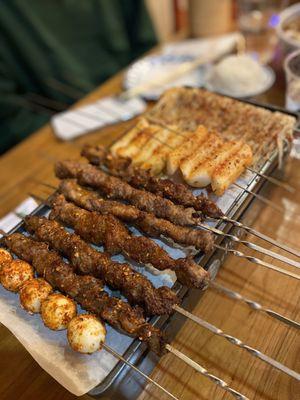 Quail eggs, Beef skewers, lamb skewers, rice cakes, enoki mushrooms