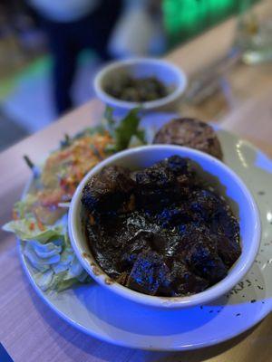 Oxtails with rice and peas