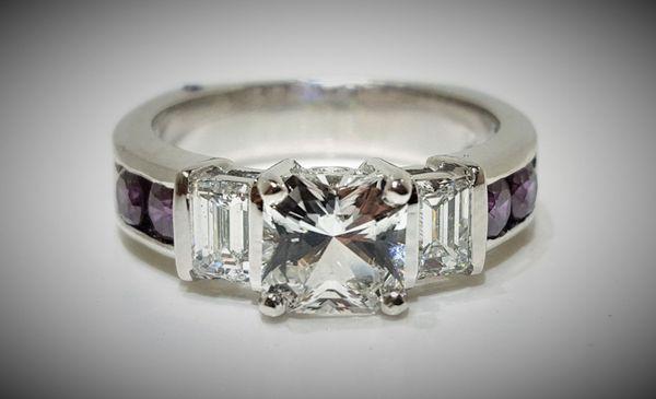 White Sapphire Center, Emerald Cut Side Diamonds and Bold Purple Diamonds on the shank.